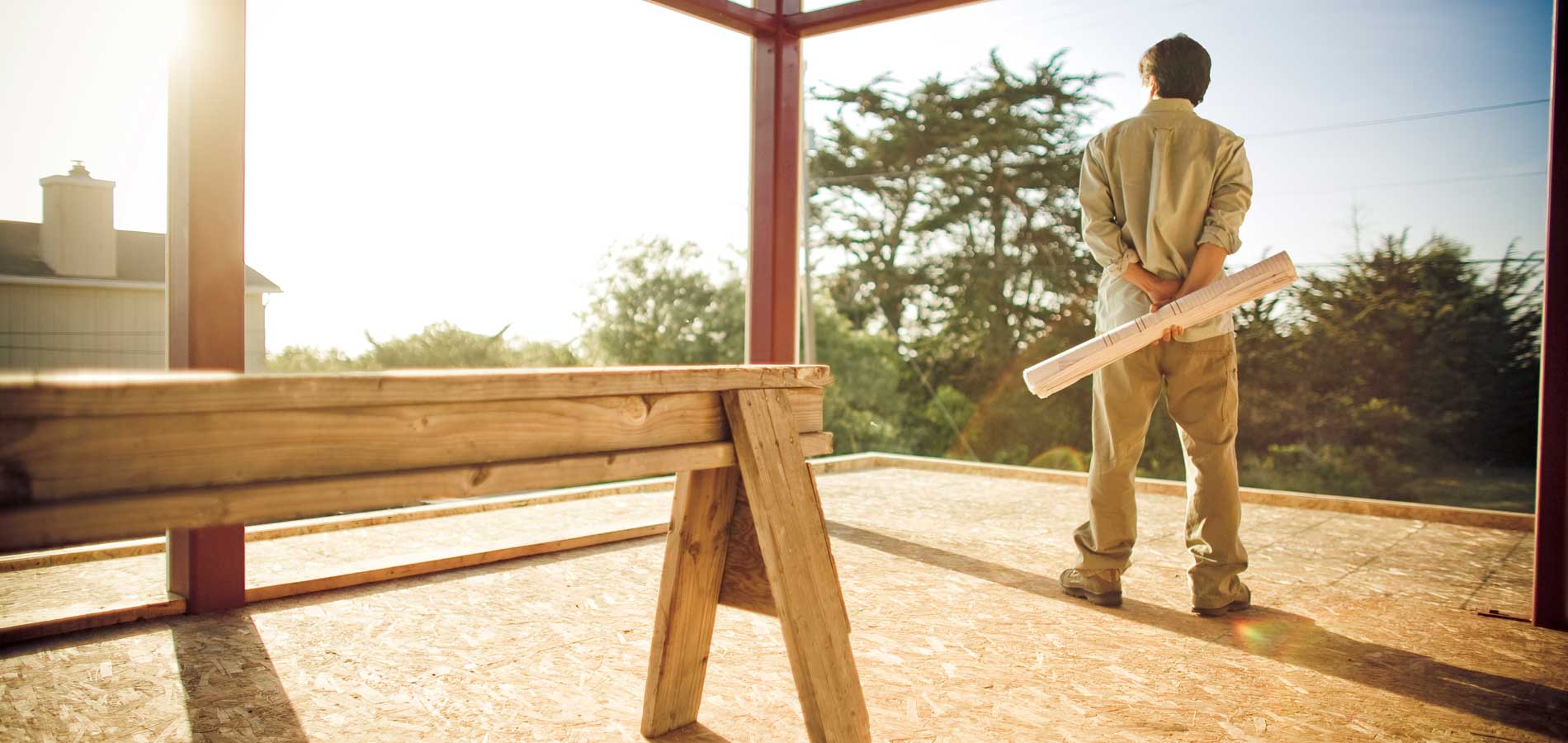 Man looking out on view from new construction
