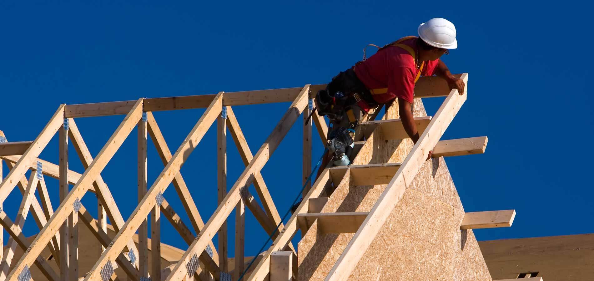 Man on new construction roof